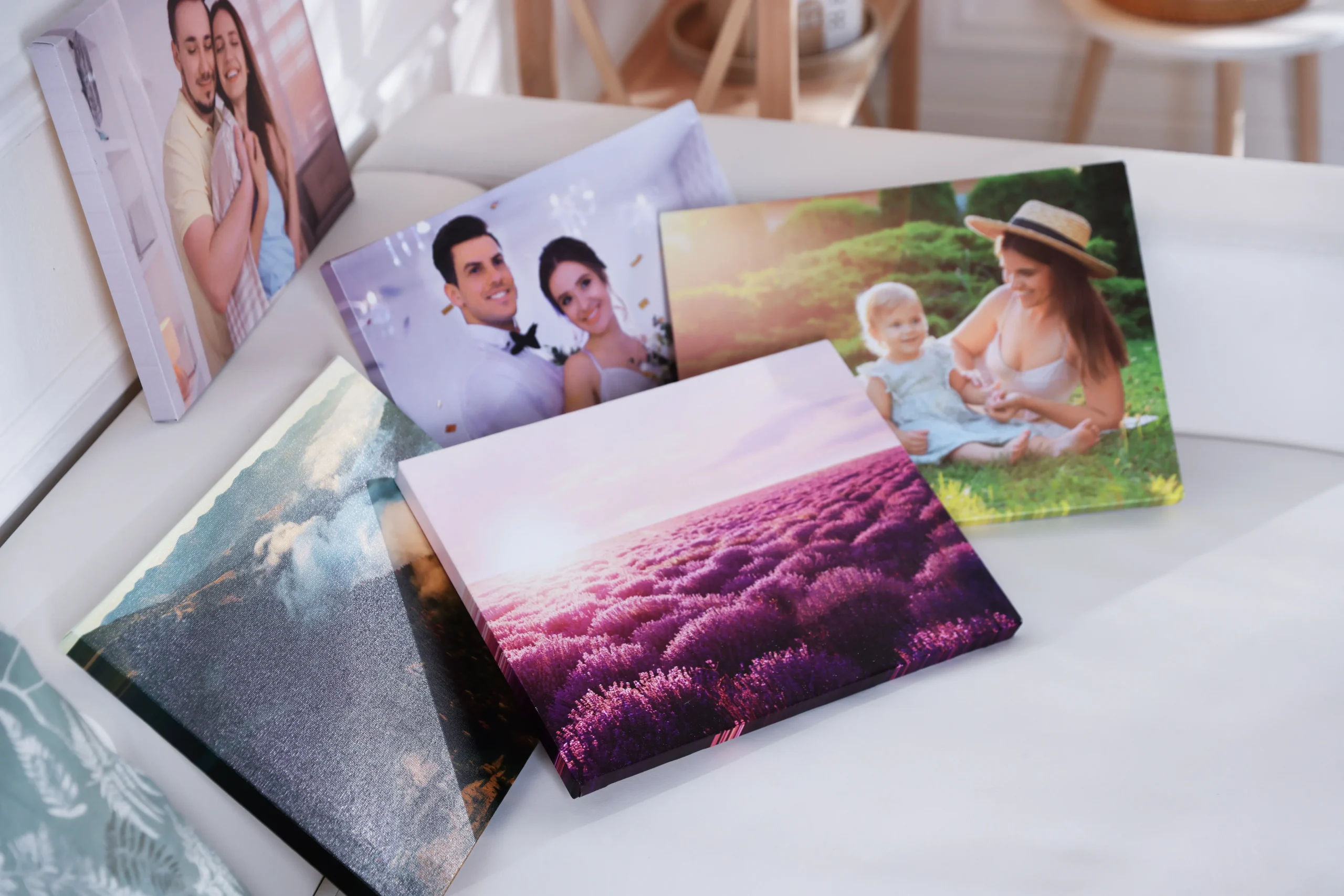 canvas-with-different-printed-photos-on-table-2025-12-31-19-31-11-utc